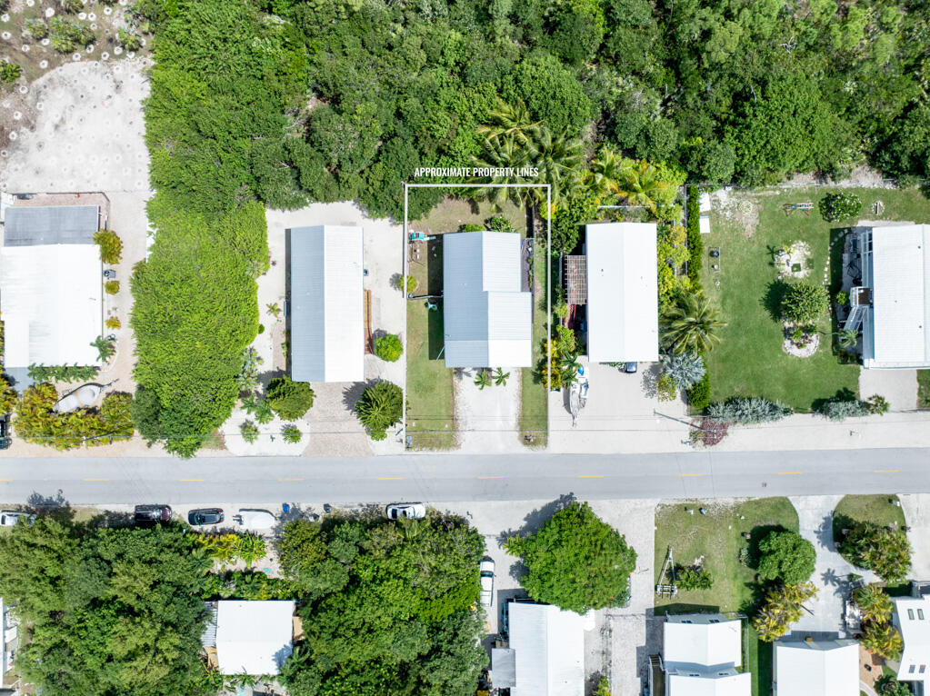 29283 Coconut Palm Drive Big Pine Key, FL 33043 - Photo 8 of 35 an aerial view of a house with a yard and potted plants