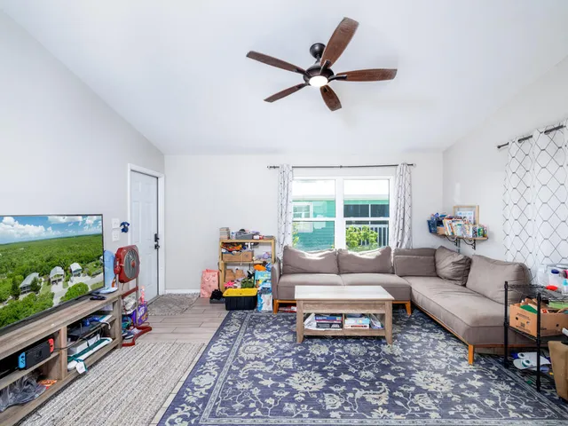 a kitchen with stainless steel appliances granite countertop a refrigerator a stove a sink and a refrigerator