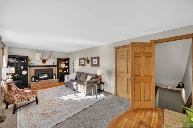 a view of a livingroom with furniture and a fireplace