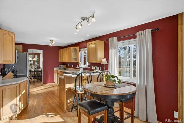 a view of a dining room with furniture and window