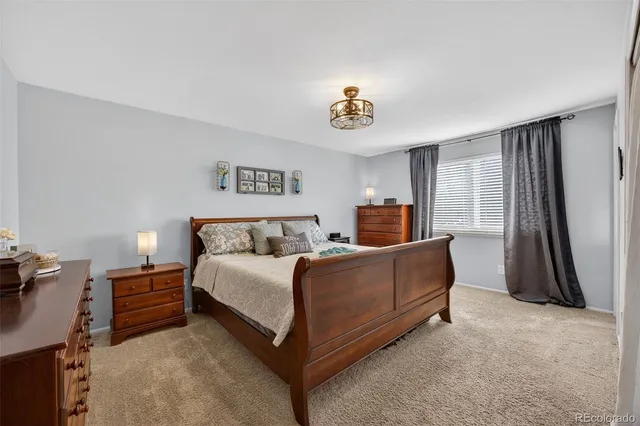 a bed room with a bed and a couch