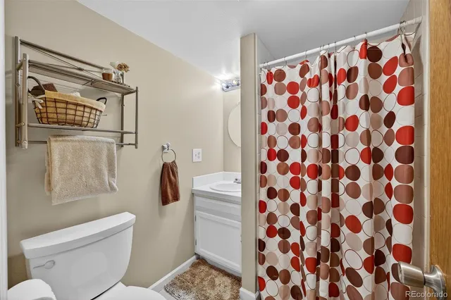 a bathroom with a shower and a toilet