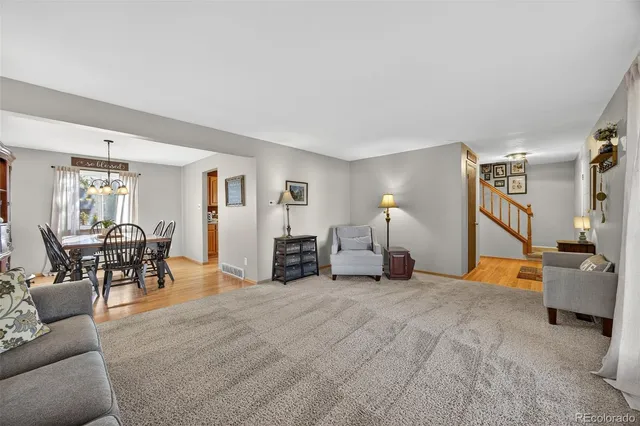 a bed room with furniture and a lamp