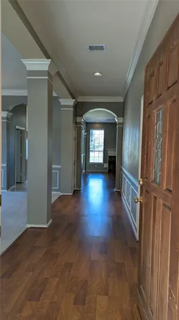 wooden floor in a hall with an entryway