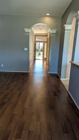 a view of gallery with wooden floor