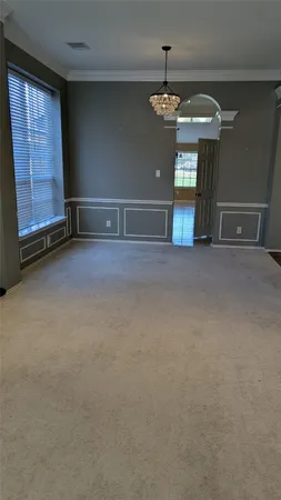 a view of an empty room with a fireplace