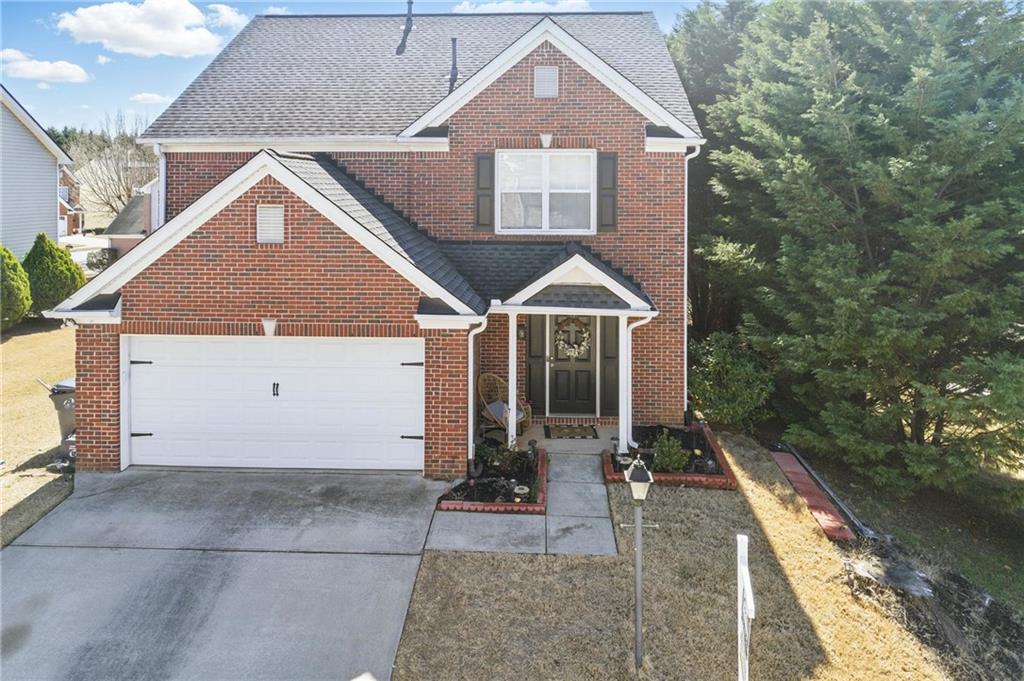 a front view of house with yard