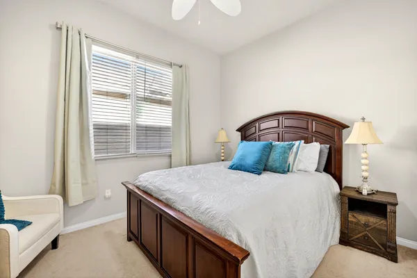 a bedroom with a bed and a couch