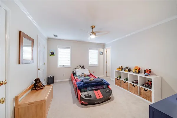 a bathroom with double vanity sink and a mirror