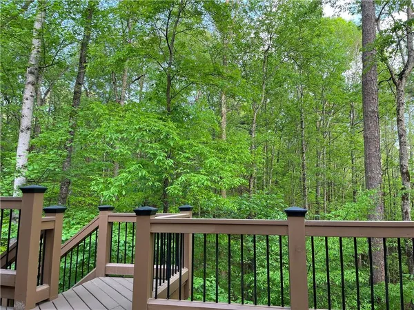 a view of a balcony with wooden floor