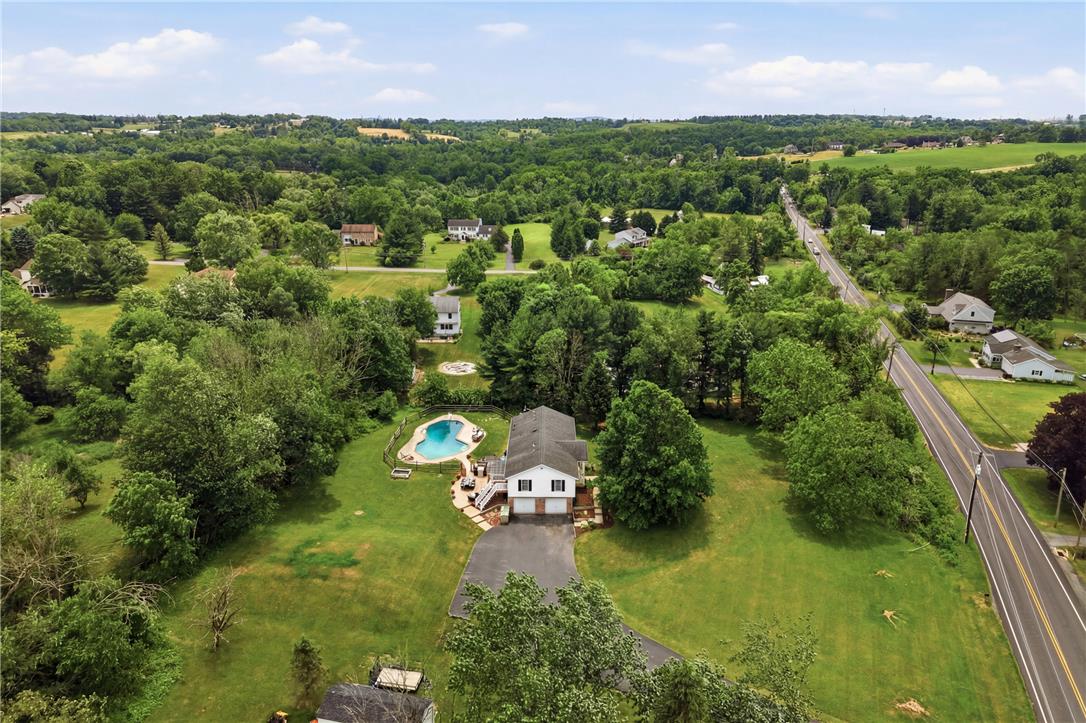 732 Bushkill Center Road Nazareth, PA 18064 - Photo 43 of 43 An aerial perspective reveals a charming dwelling with a private pool amidst a lush, sprawling landscape.