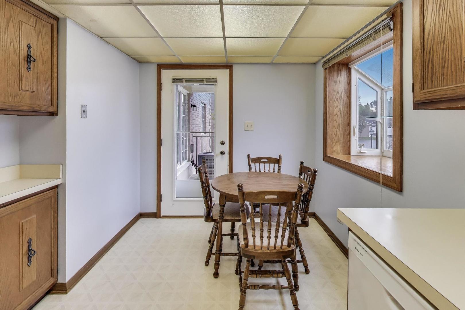 462 South President Street, Unit 202 Carol Stream, IL 60188 - Photo 10 of 26 a view of a dining room with furniture and window