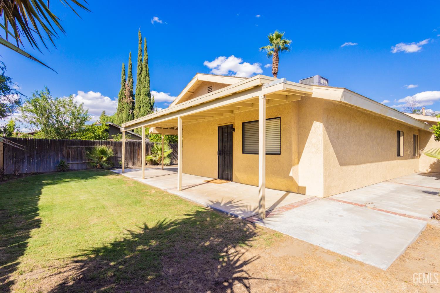 Undisclosed Address Bakersfield, CA 93309 - Photo 26 of 37 a view of a house with a backyard