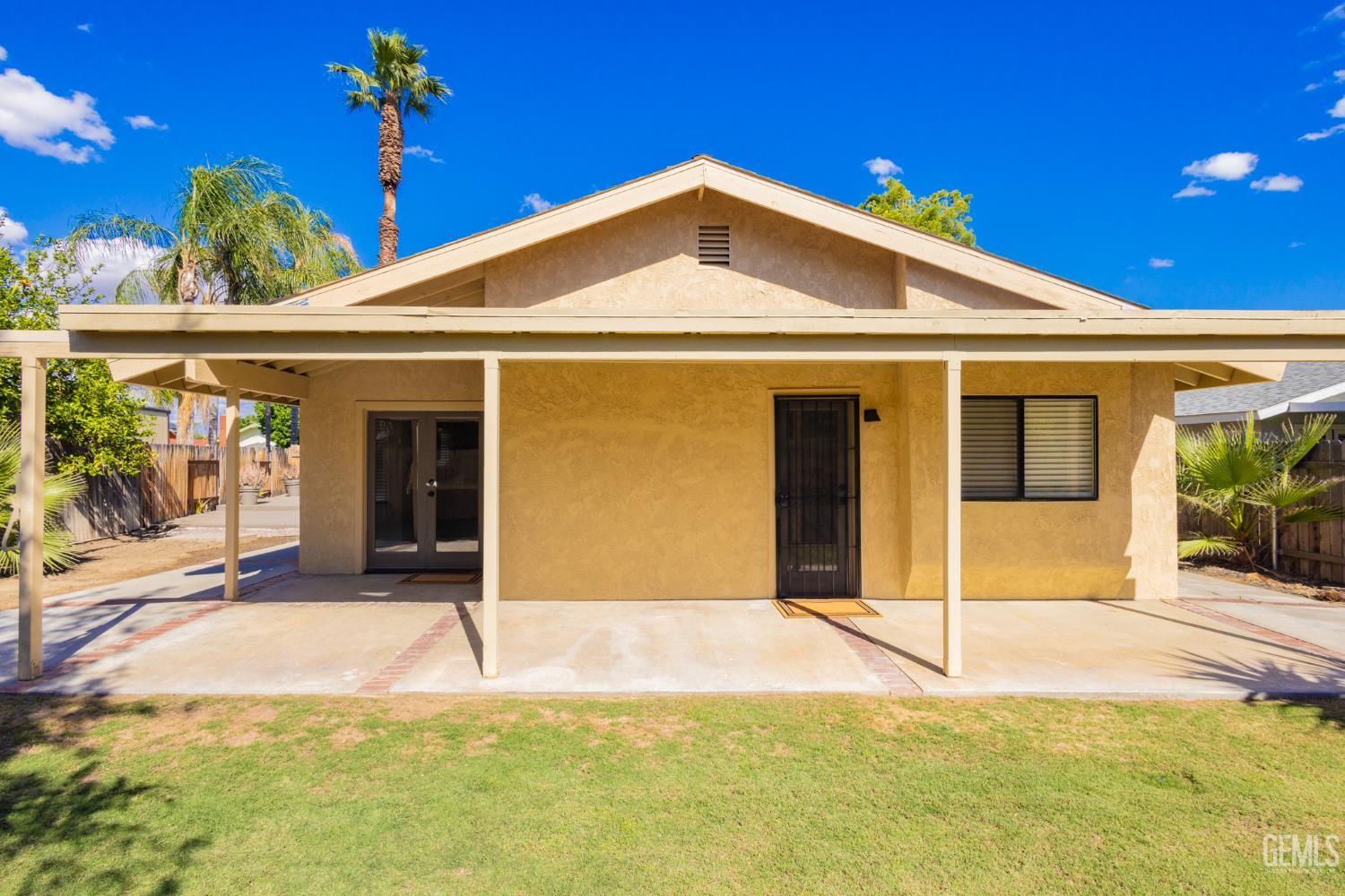 Undisclosed Address Bakersfield, CA 93309 - Photo 27 of 37 a front view of a house with a yard