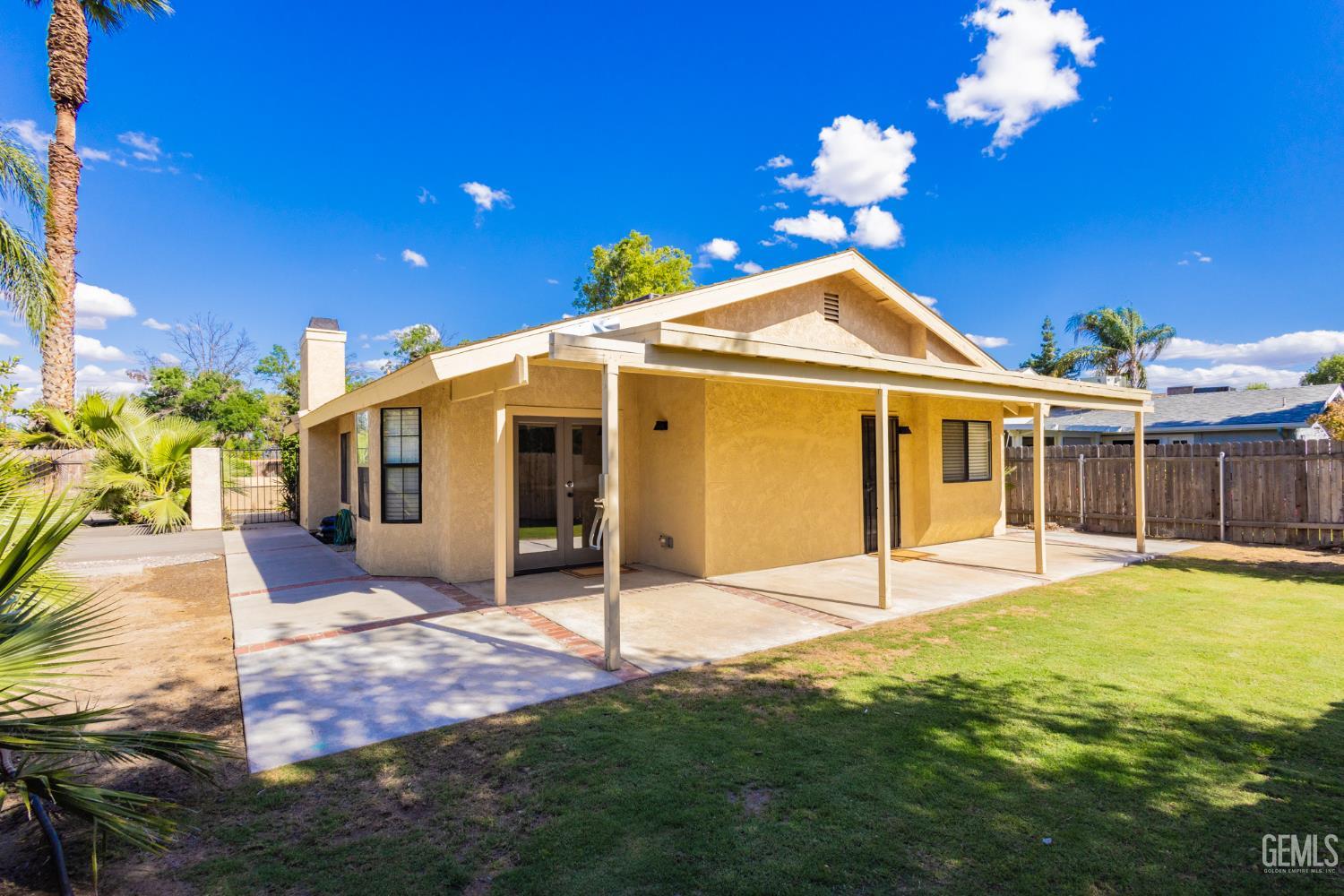 Undisclosed Address Bakersfield, CA 93309 - Photo 28 of 37 a view of a house with a big yard and potted plants