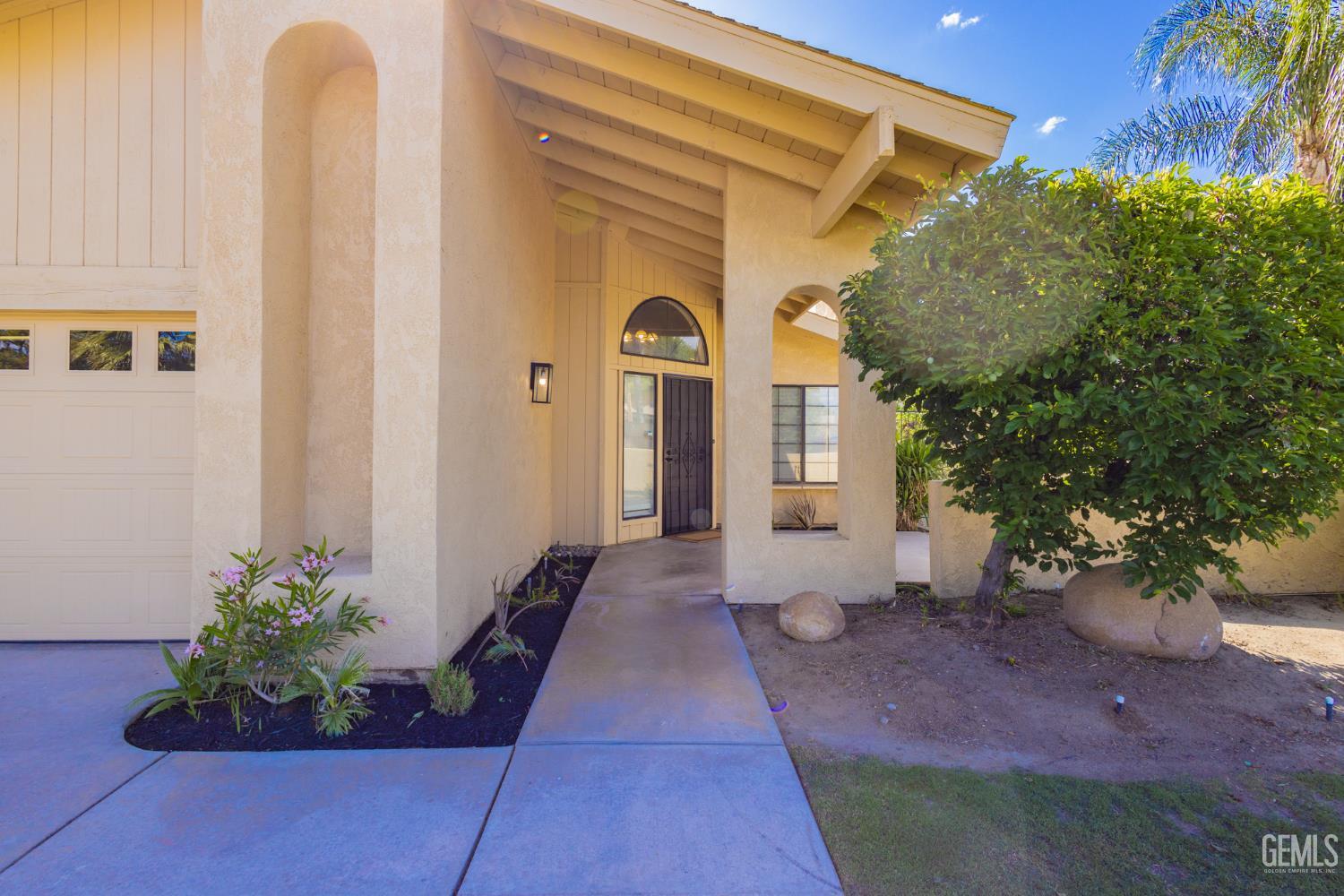 Undisclosed Address Bakersfield, CA 93309 - Photo 3 of 37 a front view of a house with a yard