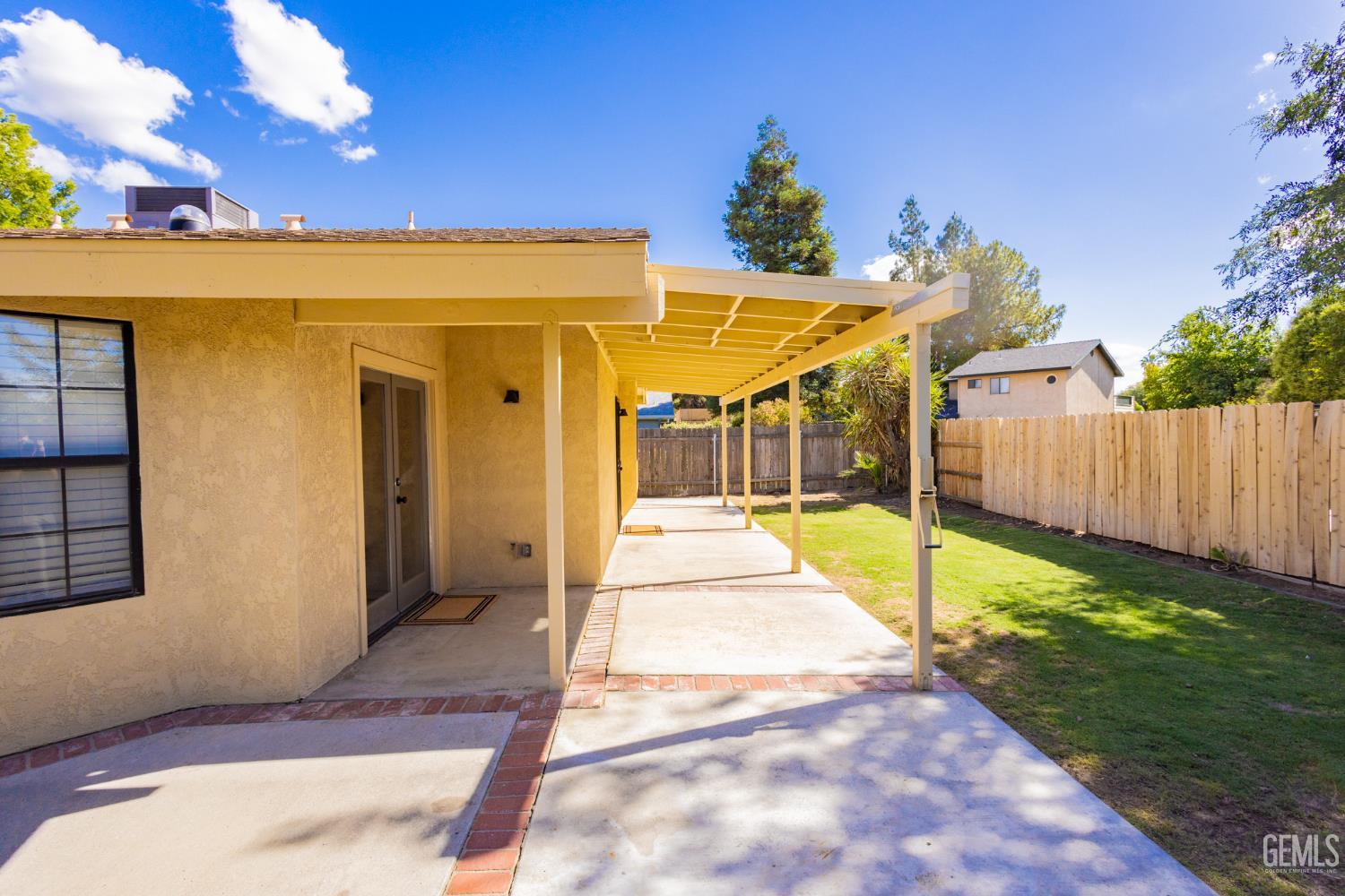 Undisclosed Address Bakersfield, CA 93309 - Photo 32 of 37 a view of a patio with a table and chairs