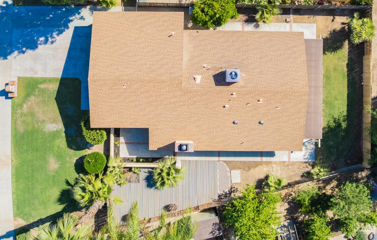 Undisclosed Address Bakersfield, CA 93309 - Photo 33 of 37 an aerial view of a house with a yard and wooden fence
