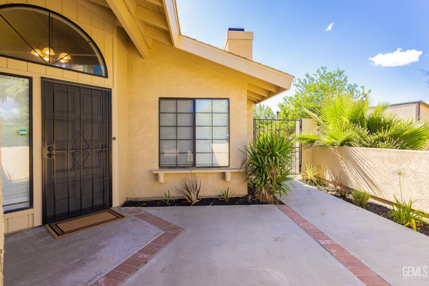 Undisclosed Address Bakersfield, CA 93309 - Photo 5 of 37 a front view of a house having yard
