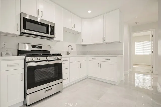 a bathroom with a toilet sink and shower