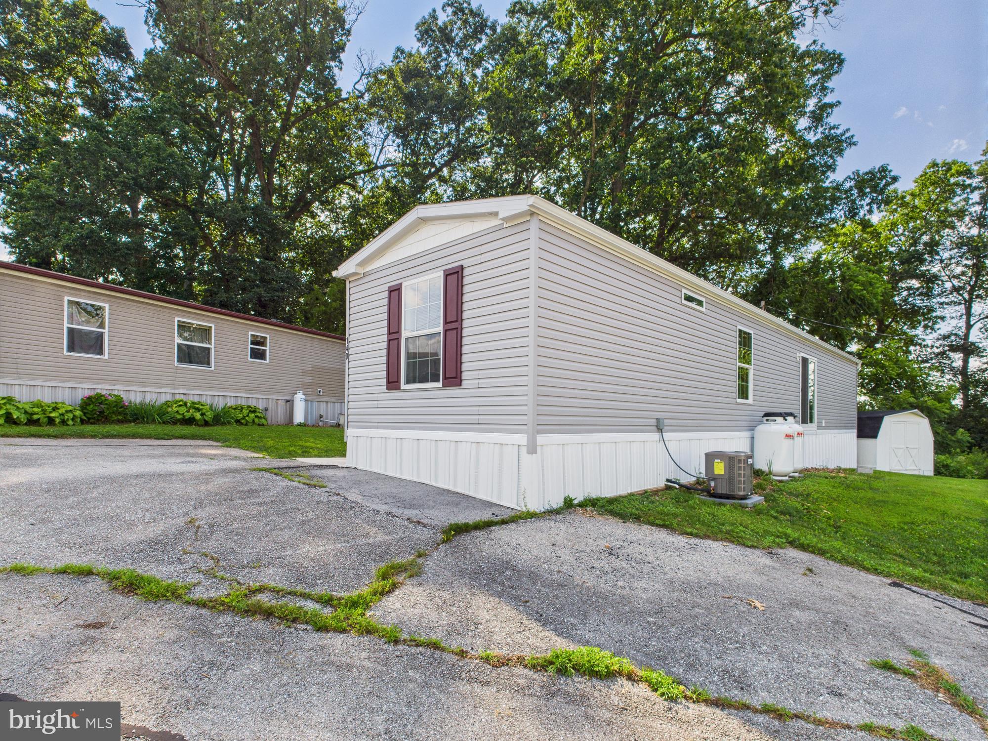 140 Rustique Drive York, PA 17408 - Photo 4 of 25 a front view of a house with a yard and garage
