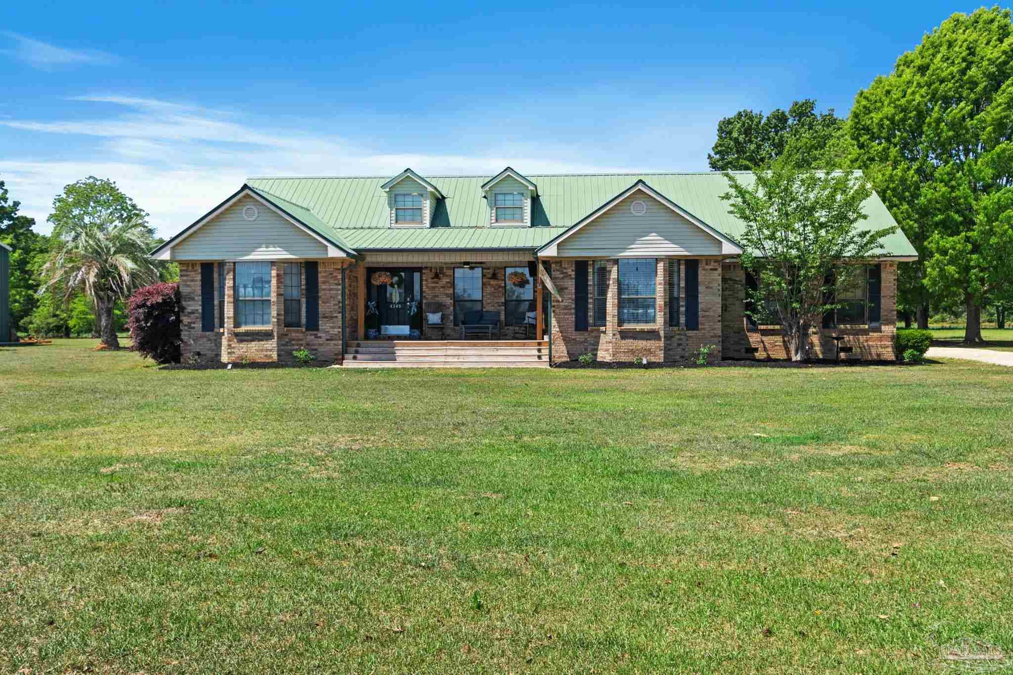 4349 Turkey Hollow Road Frisco City, AL 36445 - Photo 1 of 64 a front view of a house with a yard