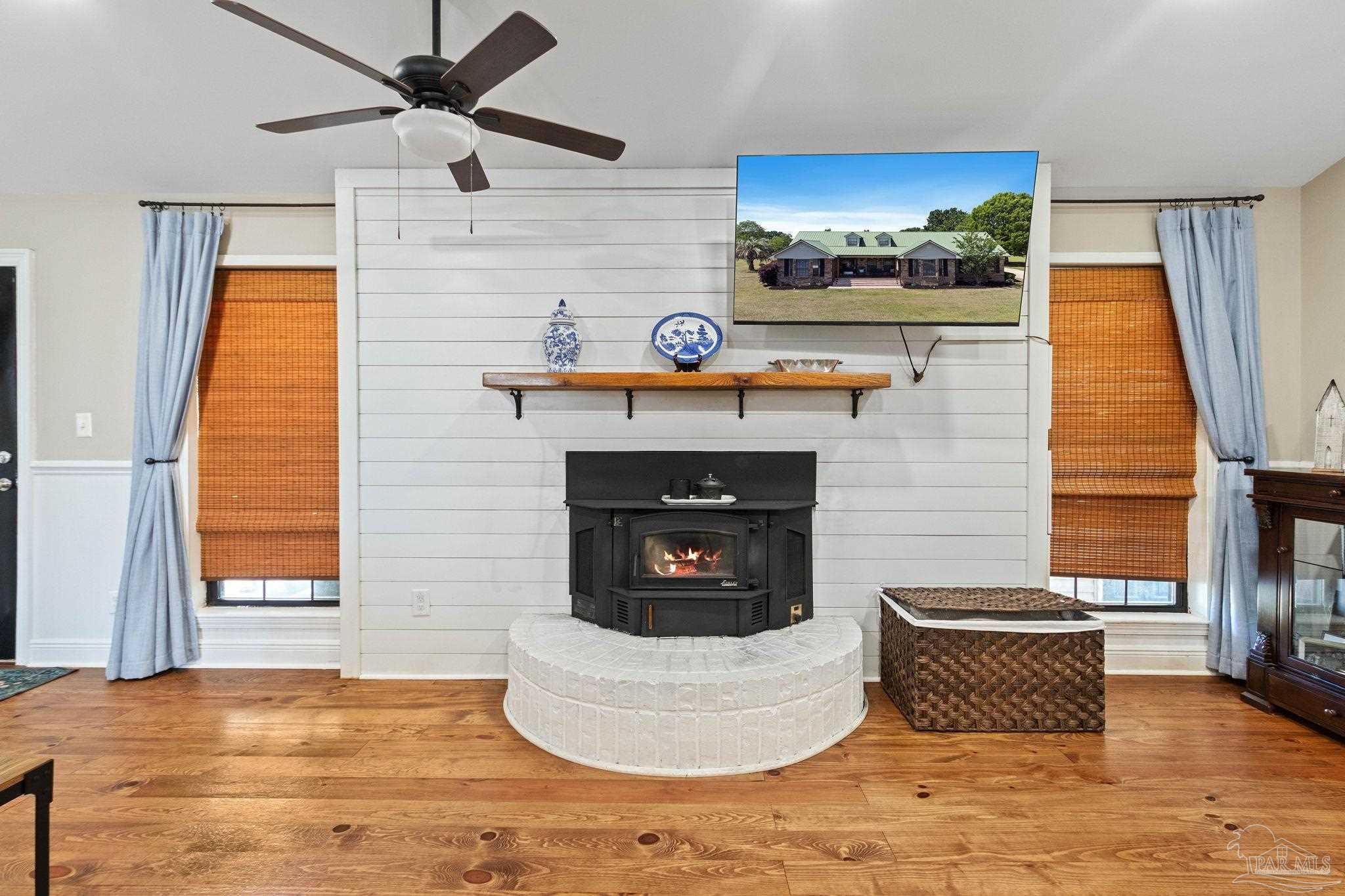 4349 Turkey Hollow Road Frisco City, AL 36445 - Photo 16 of 64 a living room with furniture and a fireplace