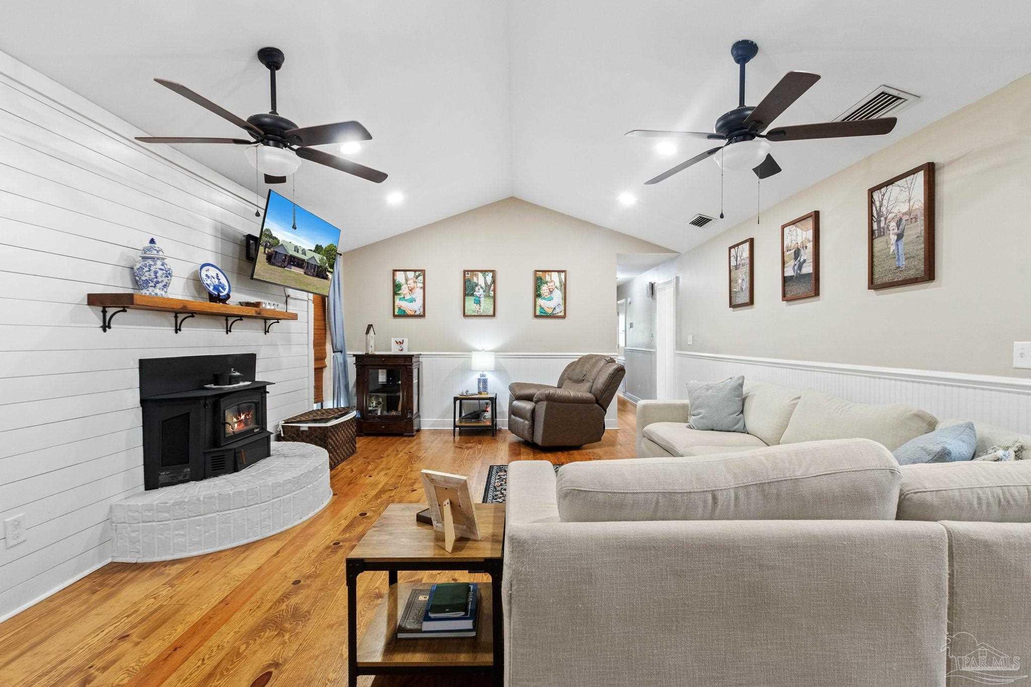4349 Turkey Hollow Road Frisco City, AL 36445 - Photo 2 of 64 a living room with furniture or fireplace and a wooden floor