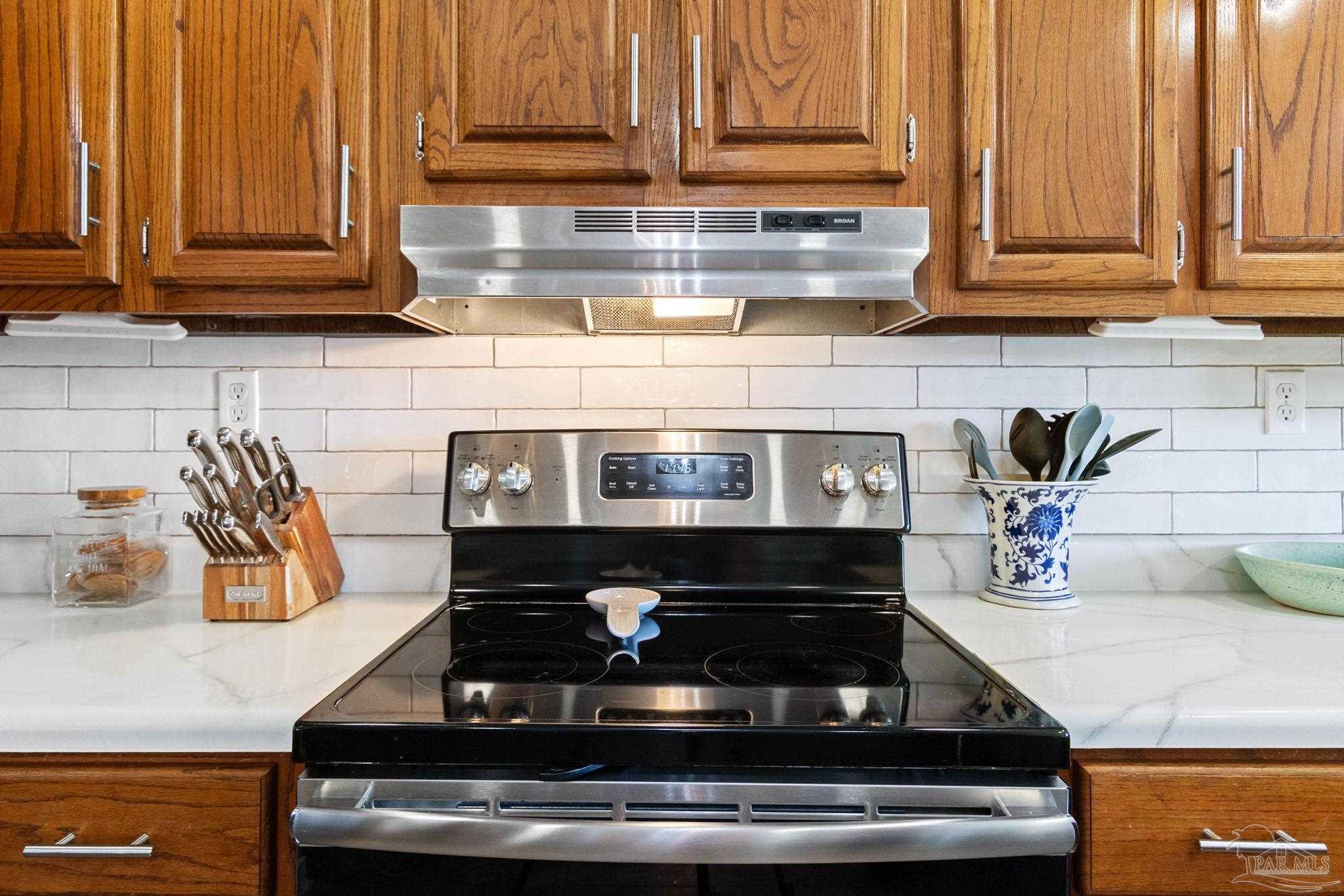 4349 Turkey Hollow Road Frisco City, AL 36445 - Photo 23 of 64 a stove top oven sitting inside of a kitchen