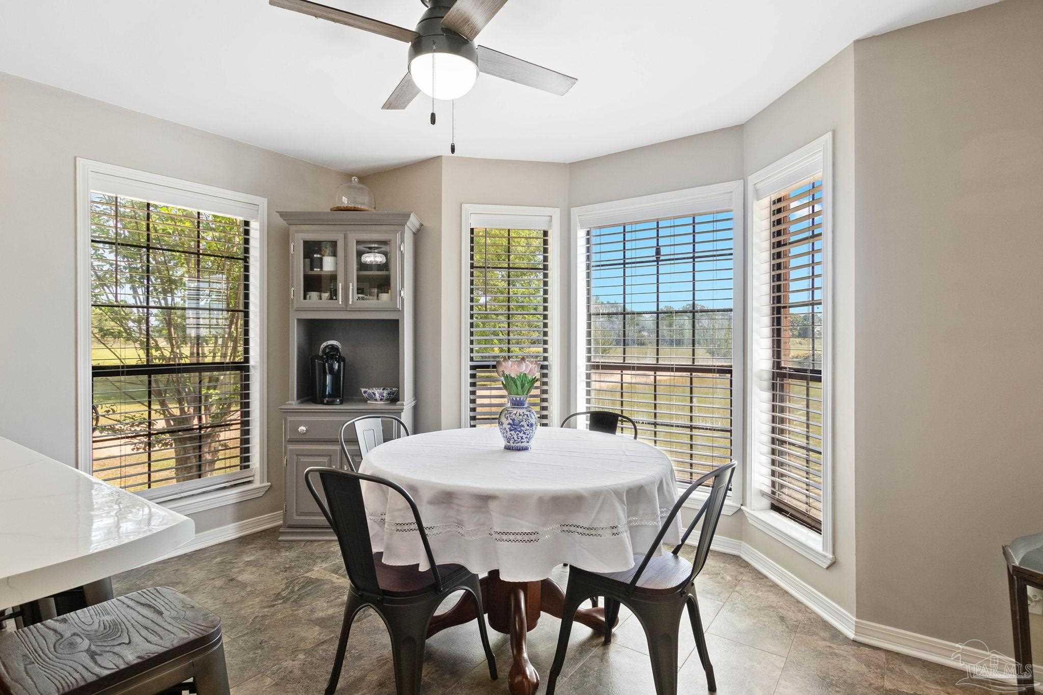 4349 Turkey Hollow Road Frisco City, AL 36445 - Photo 25 of 64 a dining room with furniture window wooden floor