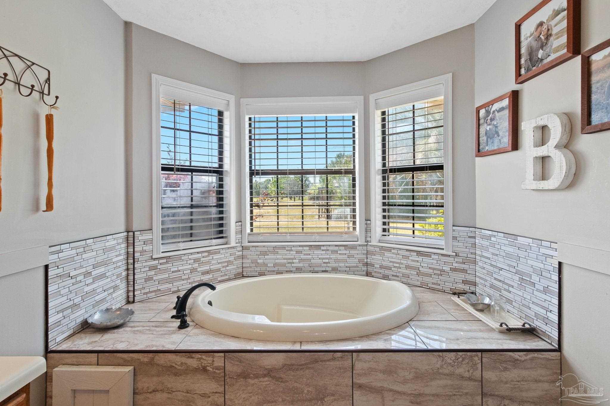 4349 Turkey Hollow Road Frisco City, AL 36445 - Photo 36 of 64 a bathroom with a sink and a bathtub