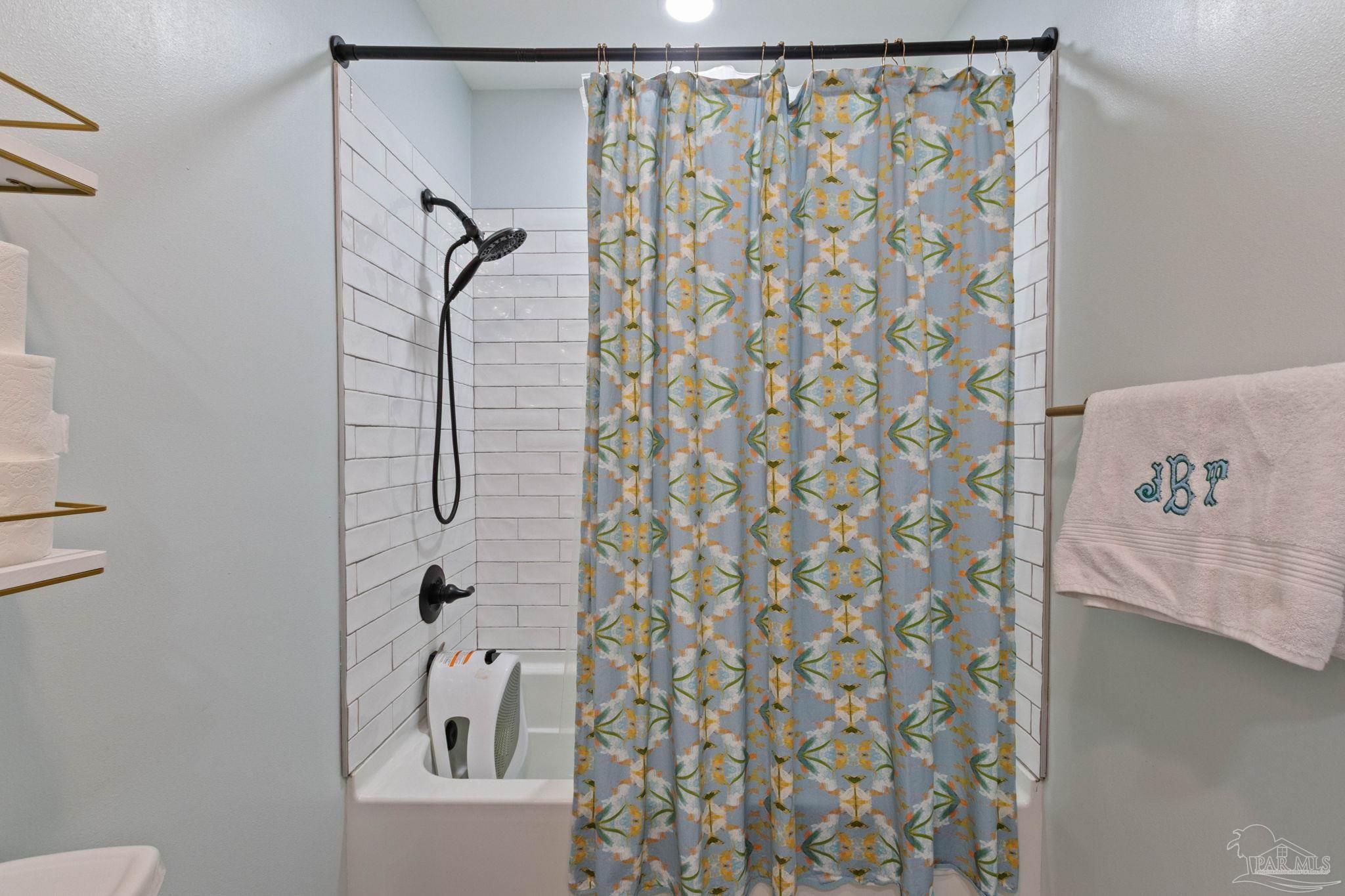 4349 Turkey Hollow Road Frisco City, AL 36445 - Photo 44 of 64 a bathroom with a shower curtain and a sink