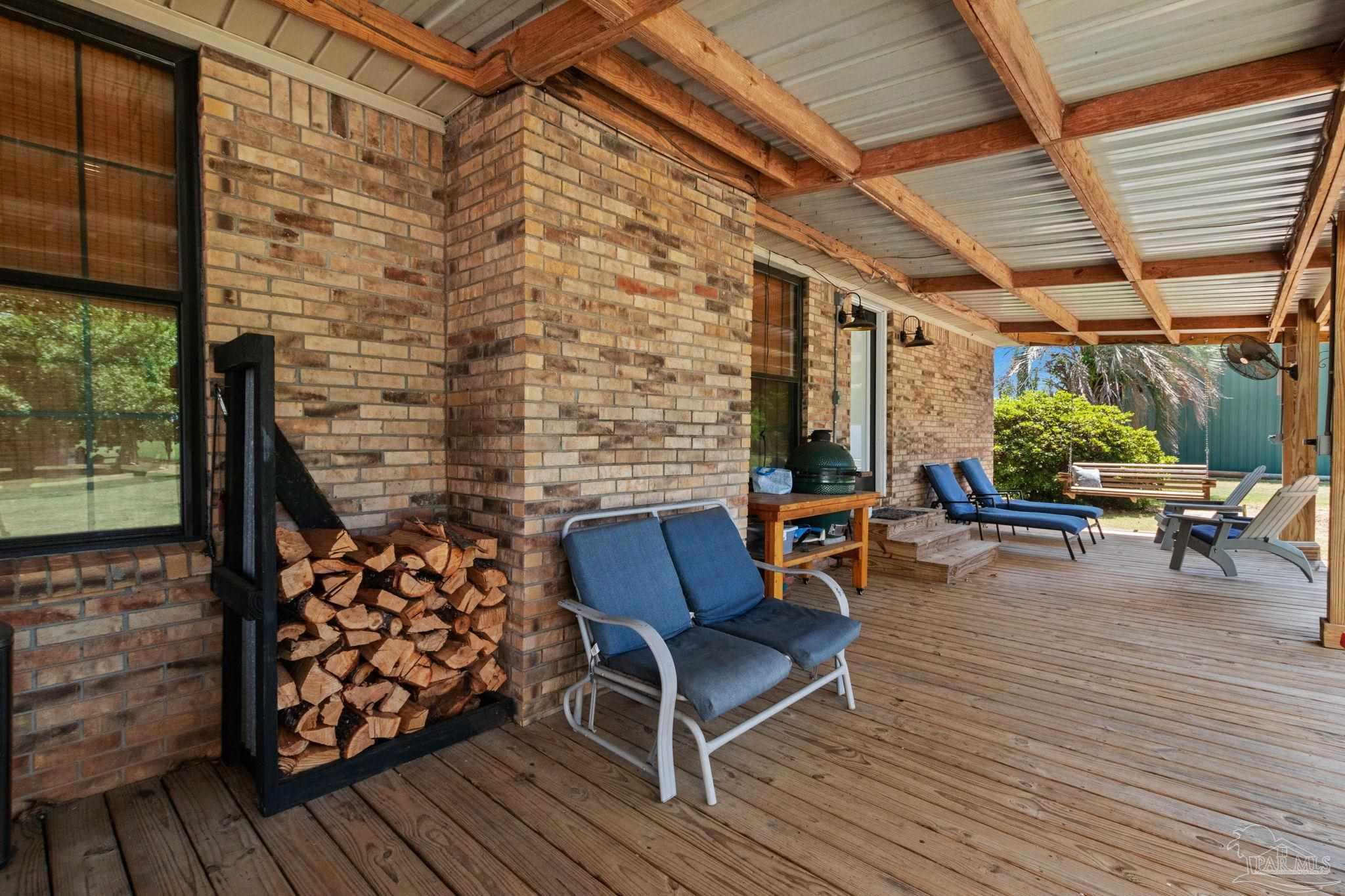 4349 Turkey Hollow Road Frisco City, AL 36445 - Photo 51 of 64 a outdoor living space with patio furniture and wooden floor