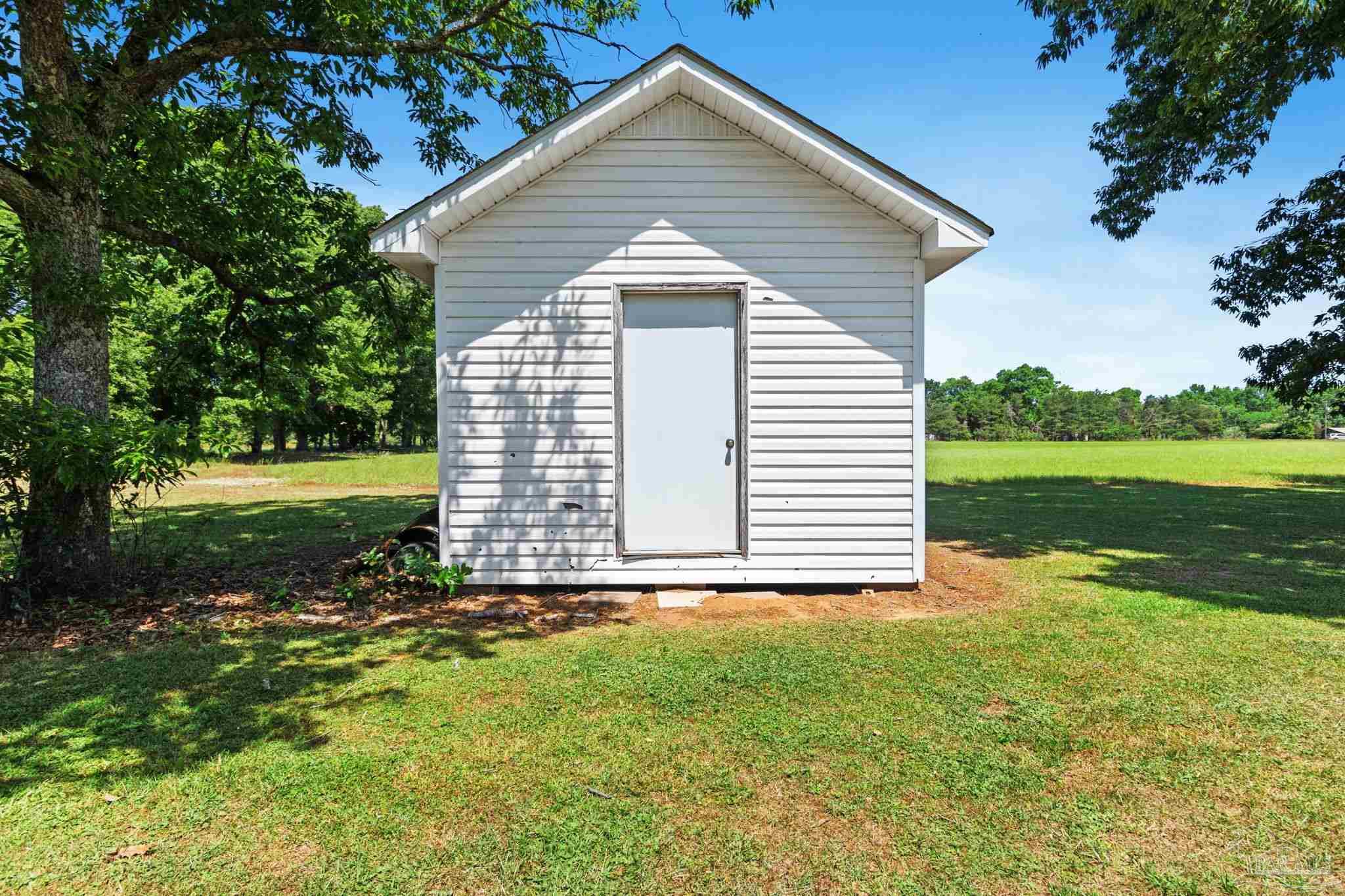 4349 Turkey Hollow Road Frisco City, AL 36445 - Photo 52 of 64 a view of a house with yard and green space