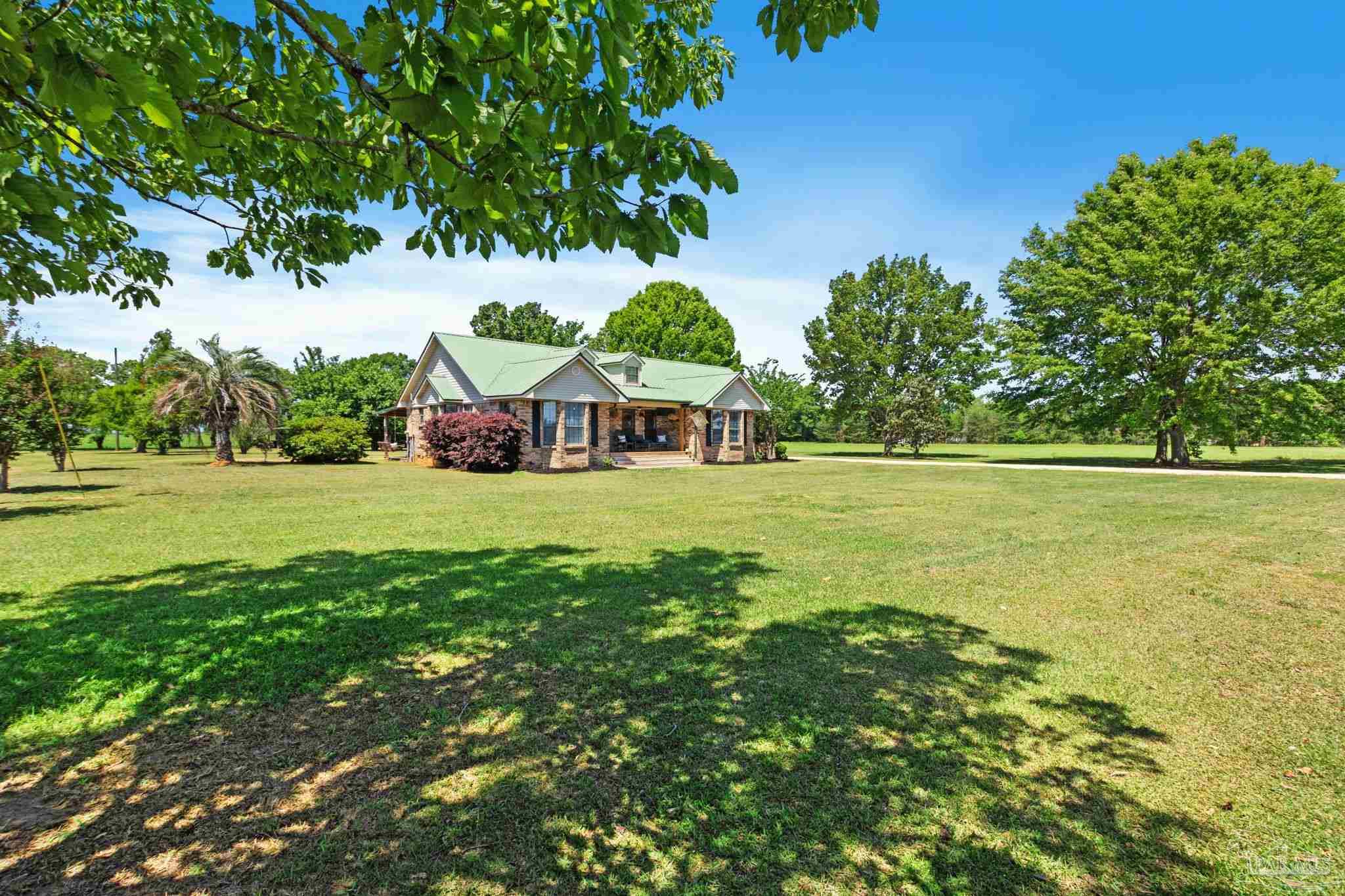 4349 Turkey Hollow Road Frisco City, AL 36445 - Photo 56 of 64 a view of a green field with wooden fence