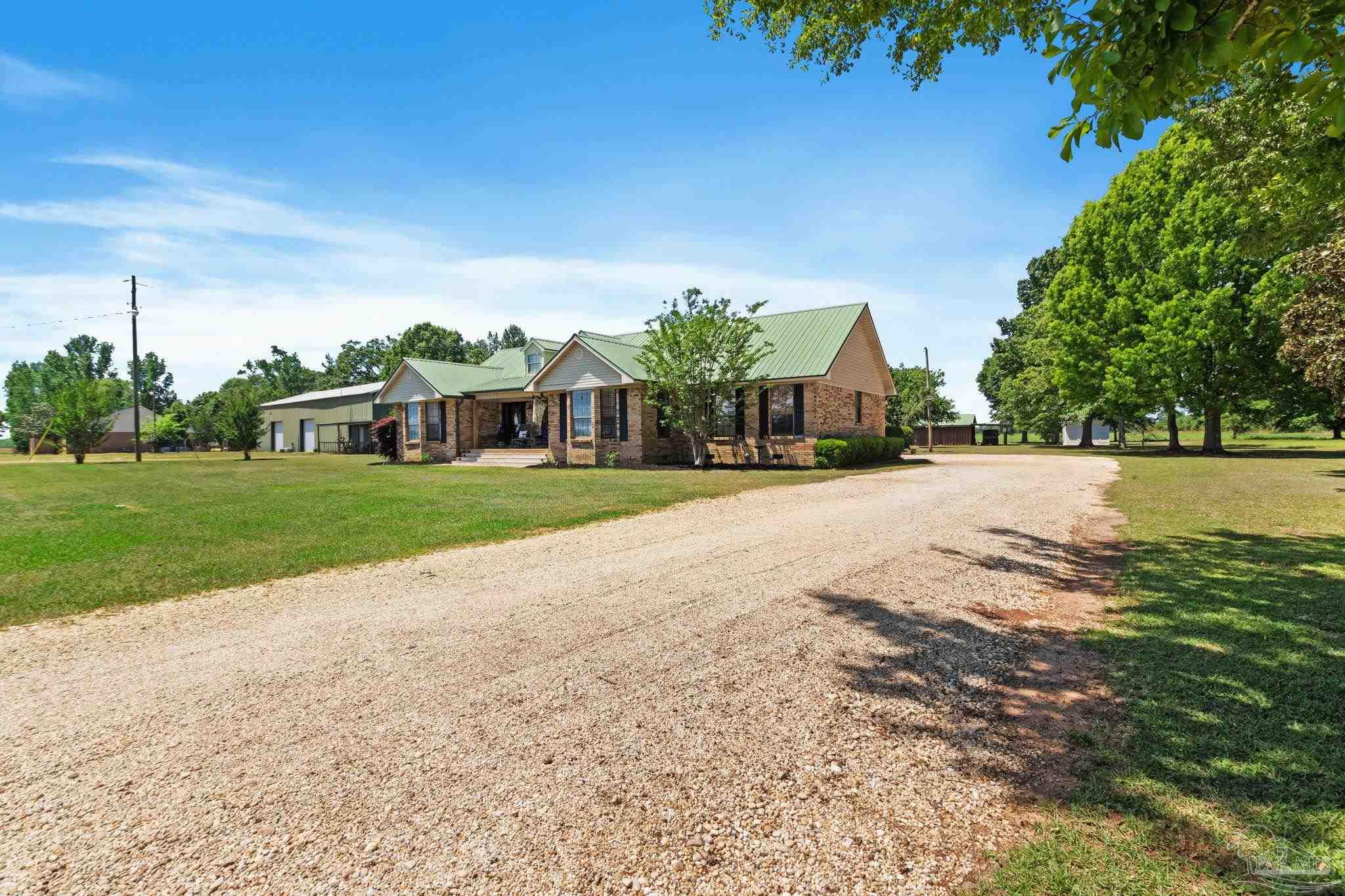4349 Turkey Hollow Road Frisco City, AL 36445 - Photo 58 of 64 a view of a house with a yard and lake view