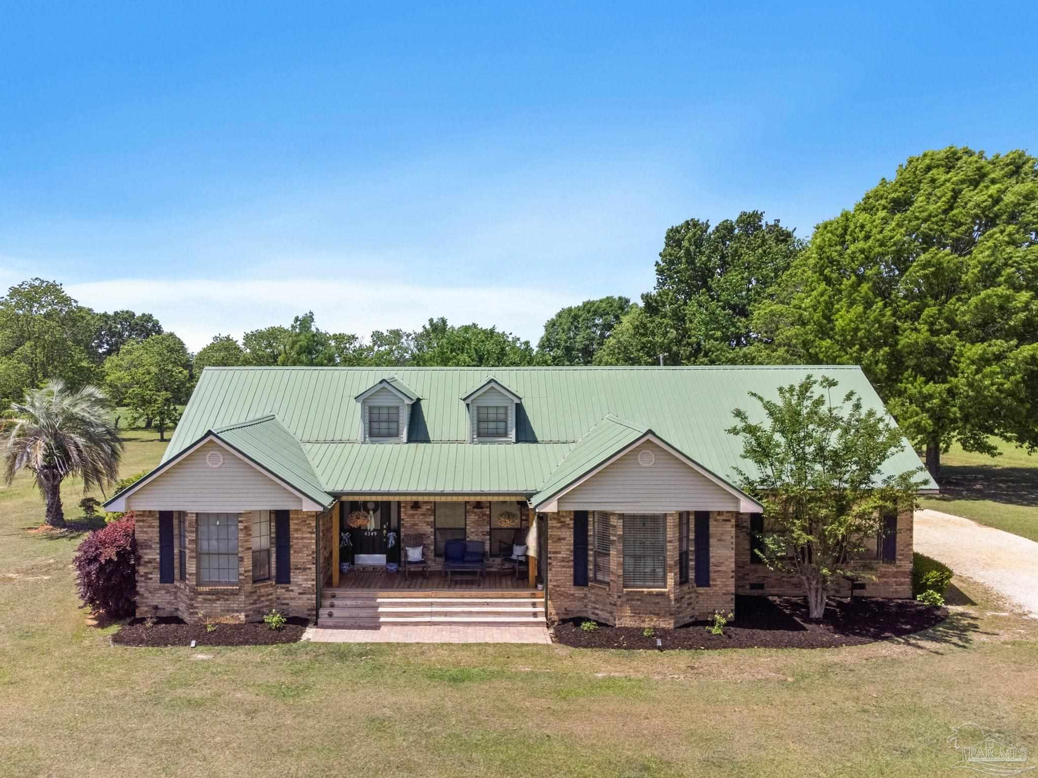 4349 Turkey Hollow Road Frisco City, AL 36445 - Photo 63 of 64 a front view of a house with a yard