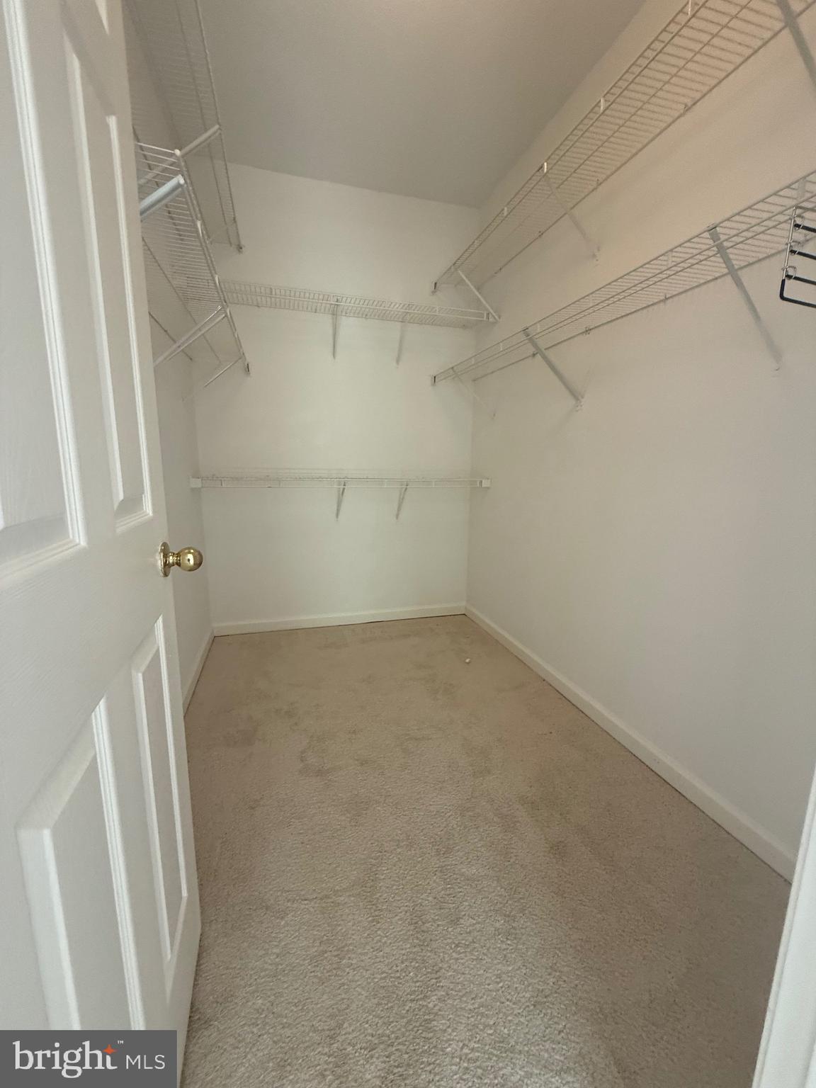 12012 Taliesin Place, Unit 24 Reston, VA 20190 - Photo 14 of 21 a view of a room with racks on the wall