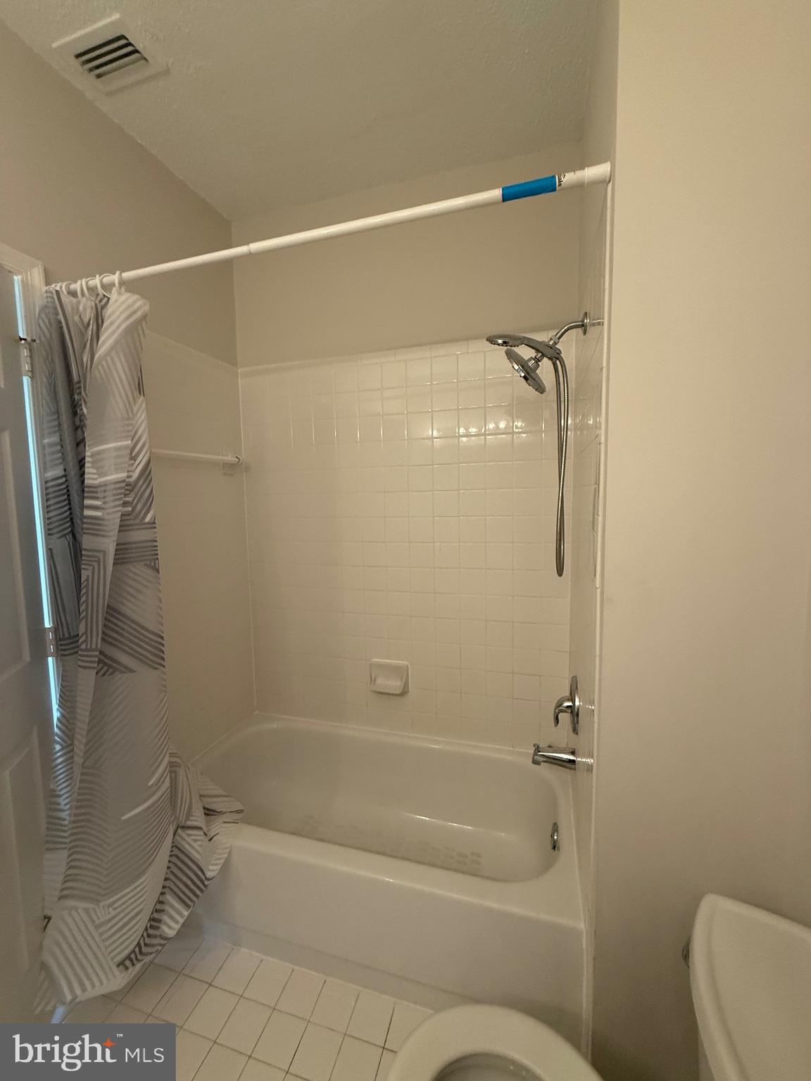 12012 Taliesin Place, Unit 24 Reston, VA 20190 - Photo 16 of 21 a bathroom with a shower and a toilet