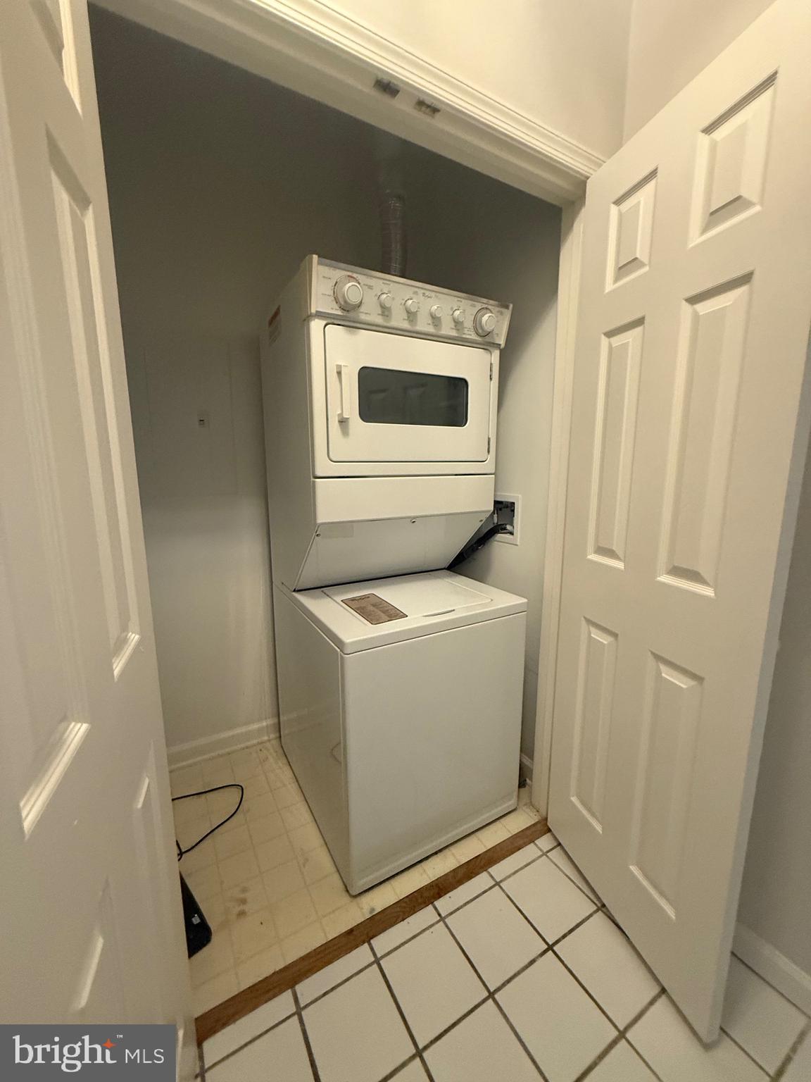 12012 Taliesin Place, Unit 24 Reston, VA 20190 - Photo 18 of 21 a utility room with dryer and washer