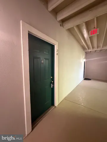 a view of a hallway with front door