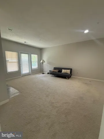 a view of livingroom with furniture and windows