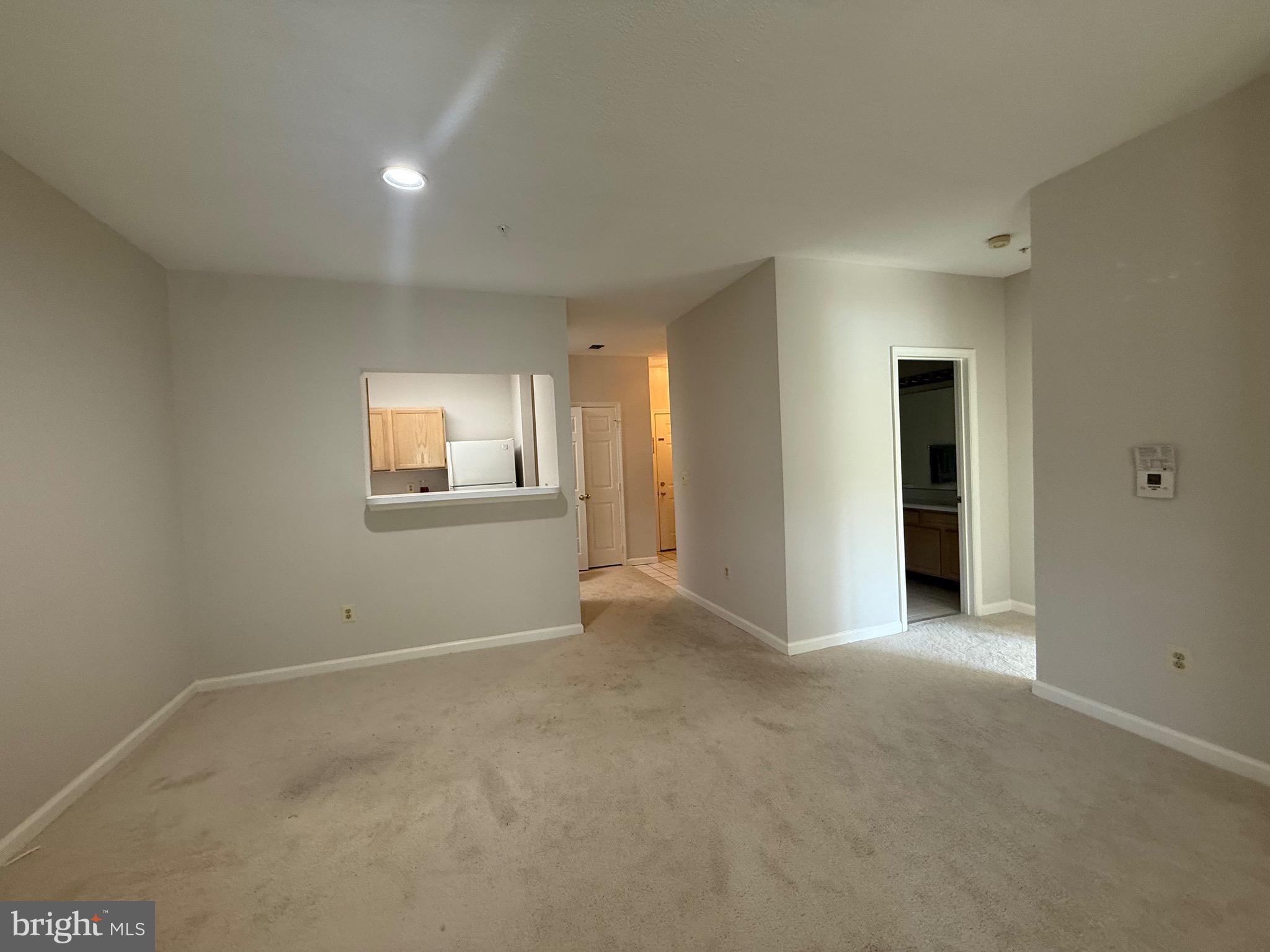 12012 Taliesin Place, Unit 24 Reston, VA 20190 - Photo 8 of 21 a view of an empty room with a window