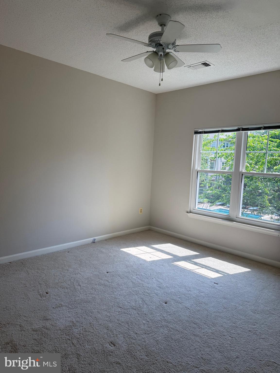 12012 Taliesin Place, Unit 24 Reston, VA 20190 - Photo 10 of 21 an empty room with a window