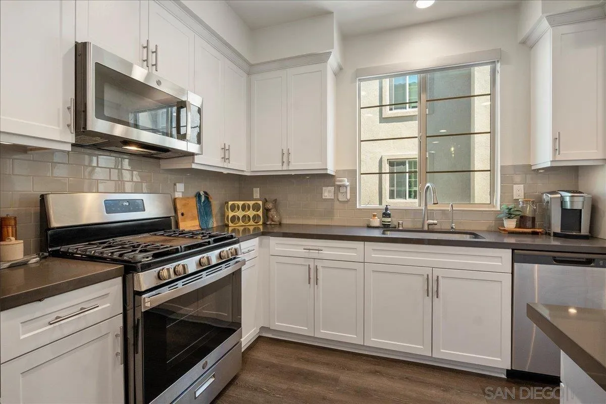 328 Paddle Court Santee, CA 92071 - Photo 15 of 45 a kitchen with stainless steel appliances granite countertop a stove a sink and a microwave