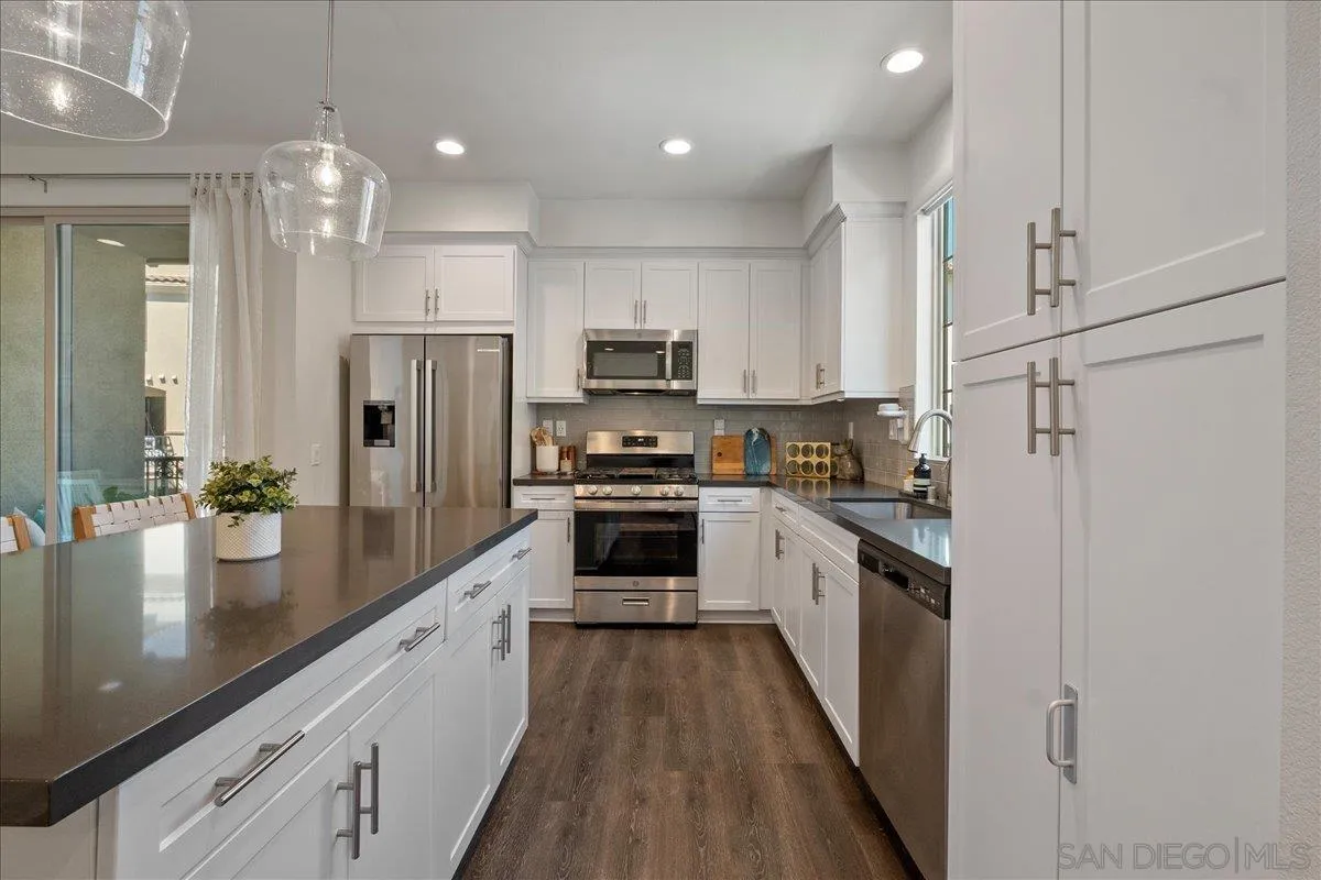 328 Paddle Court Santee, CA 92071 - Photo 17 of 45 a kitchen with refrigerator a stove and a sink