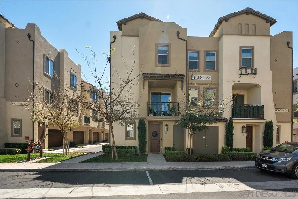 328 Paddle Court Santee, CA 92071 - Photo 2 of 45 a front view of a residential apartment building with a yard