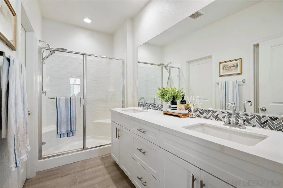 328 Paddle Court Santee, CA 92071 - Photo 26 of 45 a bathroom with a double vanity sink shower and a mirror