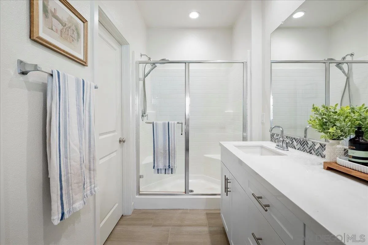 328 Paddle Court Santee, CA 92071 - Photo 27 of 45 a bathroom with a double vanity sink and mirror