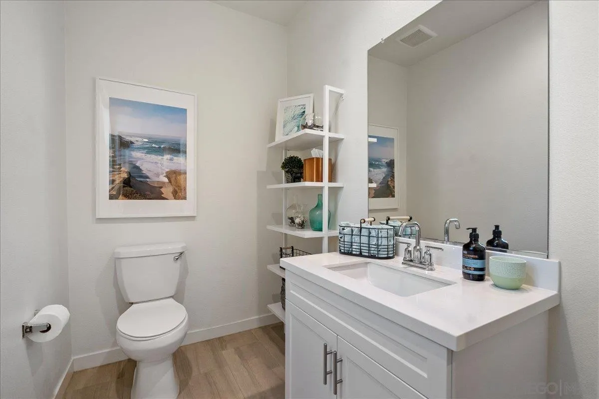 328 Paddle Court Santee, CA 92071 - Photo 8 of 45 a bathroom with a toilet sink and mirror